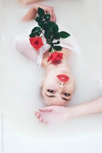 Beautiful woman in milk bath