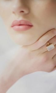 Woman's lips and hand