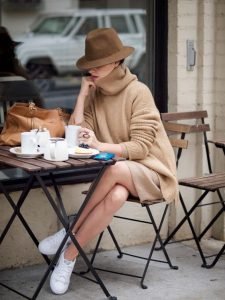 Woman outside at the cafe table