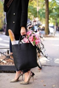 Woman in heels with bag full of stuff