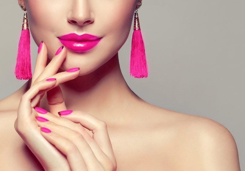 15 Ways To Replenish Your Feminine Energy woman with pink nails and lips pink earrings | The Sublime Woman