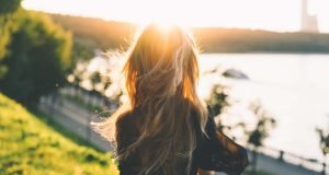 How to Stop Losing Energy, Woman with long hair by the water, feminine energy | The Sublime Woman