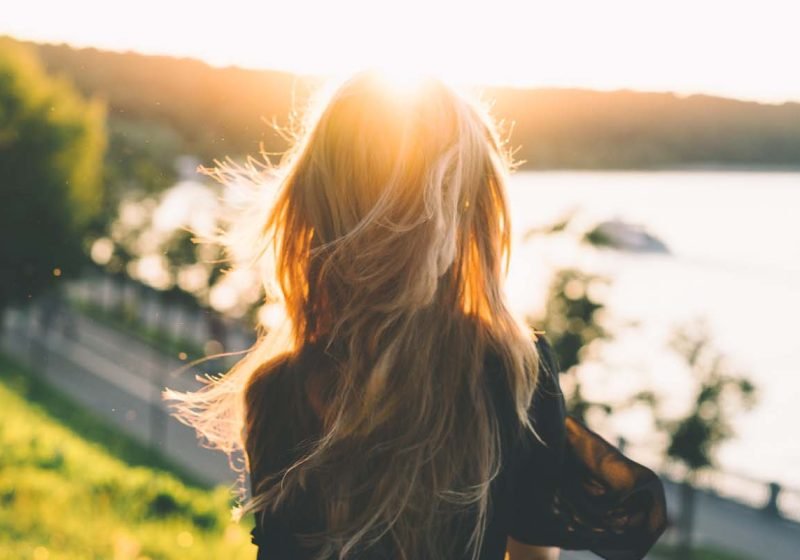 How to Stop Losing Energy, Woman with long hair by the water, feminine energy | The Sublime Woman