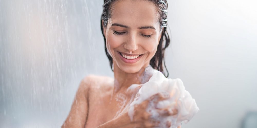 Woman under the shower energy practice | The Sublime Woman