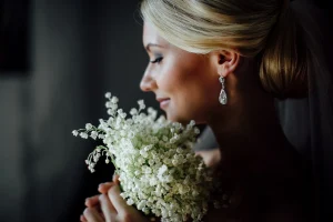 Blonde woman holding flowers energetic hygiene for women | The Sublime Woman