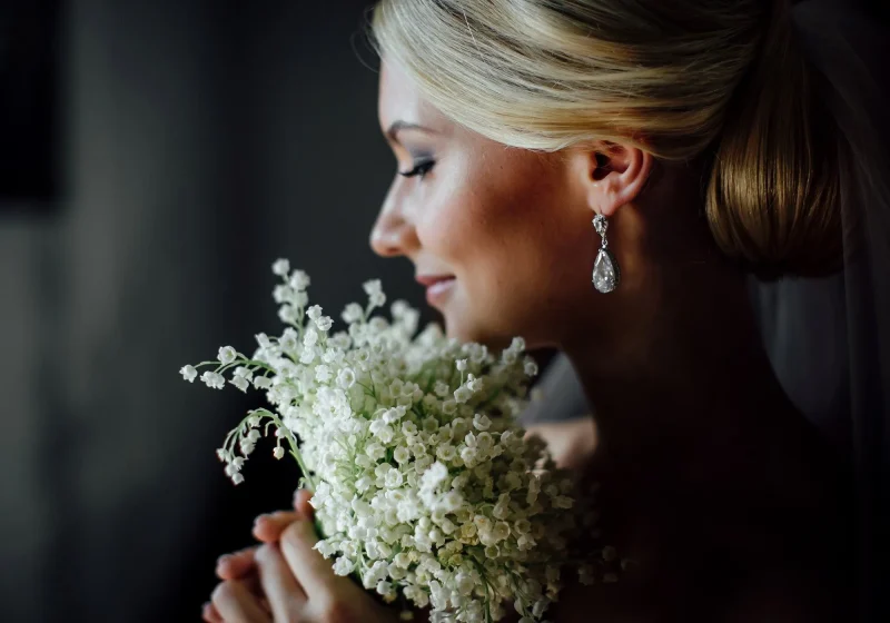Blonde woman holding flowers energetic hygiene for women | The Sublime Woman