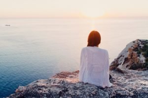 Woman watching the water wise woman's energy secrets | The Sublime Woman