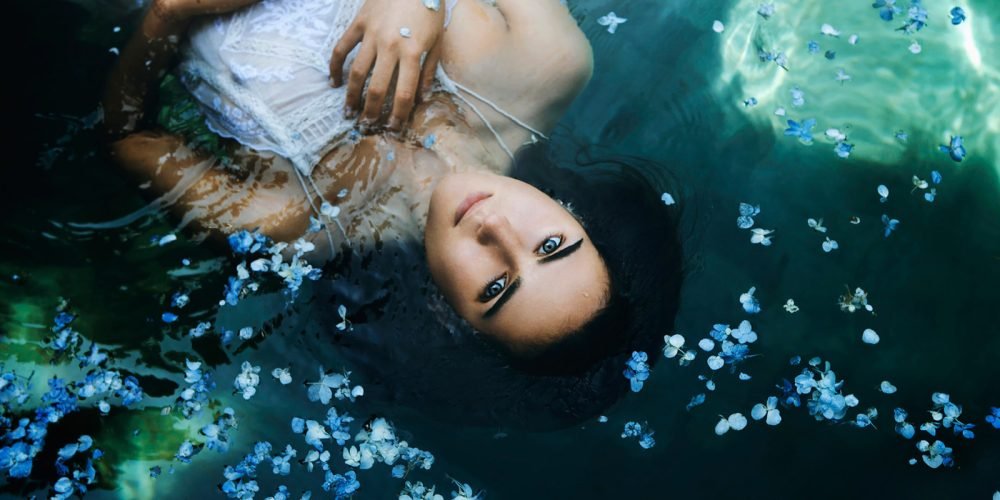Woman watching the water wise woman's energy secrets | The Sublime Woman