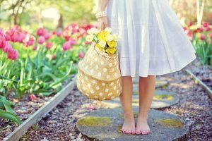Earth Energy for Woman woman barefoot with flowers | The Sublime Woman