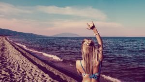 How to balance masculine and feminine energy beautiful woman on the beach | The Sublime Woman