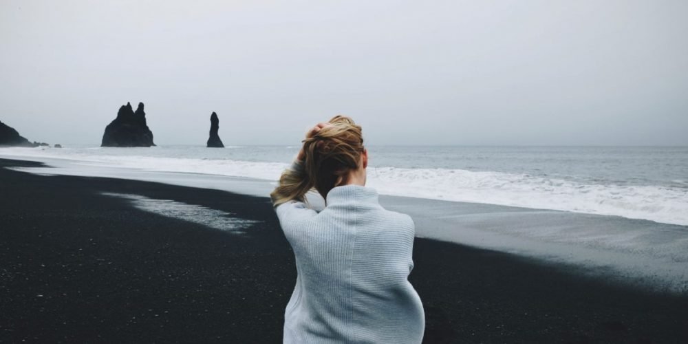 Strengthening energy protection aura exercise woman sitting on the beach | The Sublime Woman