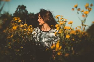 Fragrances for Health And Beauty beautiful woman with flowers field of sunflowers | The Sublime Woman
