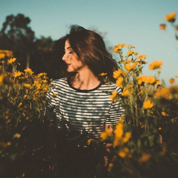 Fragrances for Health And Beauty beautiful woman with flowers field of sunflowers | The Sublime Woman