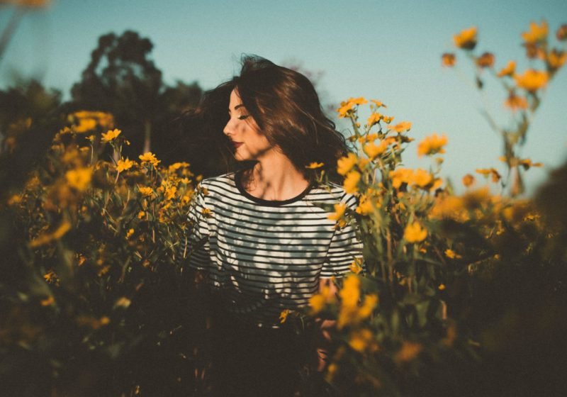 Fragrances for Health And Beauty beautiful woman with flowers field of sunflowers | The Sublime Woman