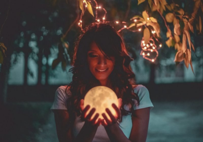 Vedic Astrology for Wise Women woman holding a moon | The Sublime Woman