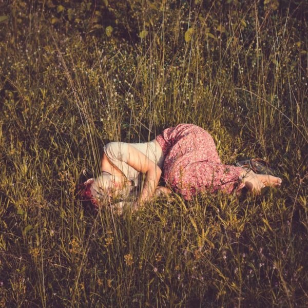 Feminine Rest Relaxing like a Woman beauiful woman laying in the field of flowers | The Sublime Woman