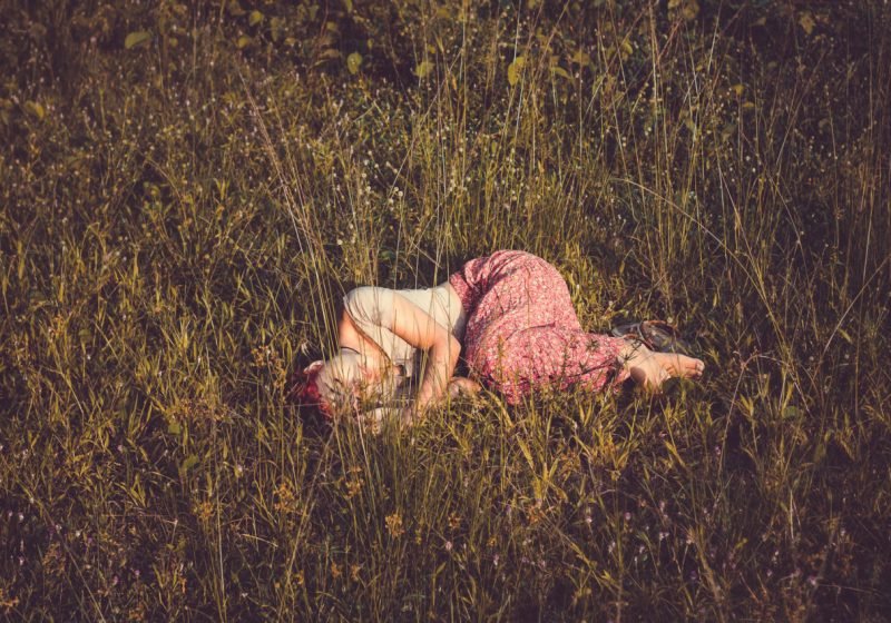 Feminine Rest Relaxing like a Woman beauiful woman laying in the field of flowers | The Sublime Woman
