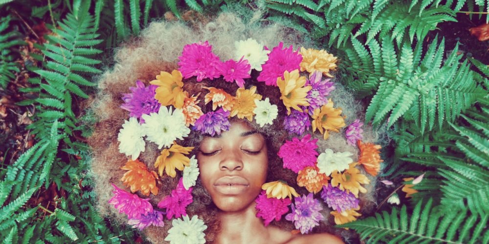 Overcoming Hurt Feminine Rituals beautiful black woman with flowers | The Sublime Woman