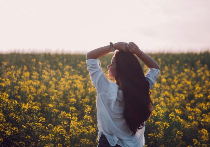 Woman's Dignity beautiful woman with long hair in the field of wild flowers | The Sublime Woman