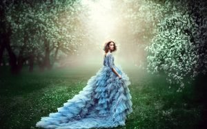 Practice Woman's Vishuddha Chakra Healing beautiful woman in blue fluffy dress in the woods | The Sublime Woman