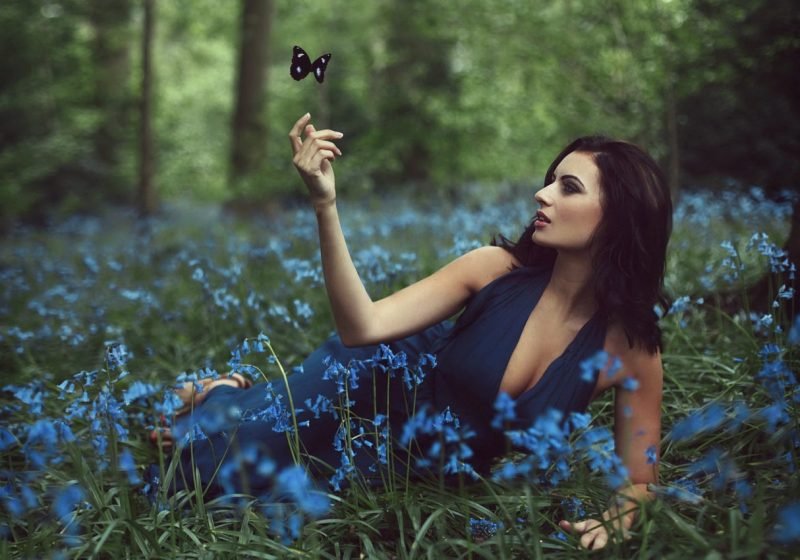 Practice: Woman’s Ajna Chakra Healing beautiful woman in dark blue dress in forest and flowers | The Sublime Woman