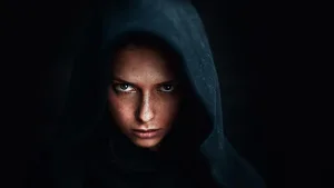 A mysterious woman in dark hood — symbolizing the dark feminine archetype